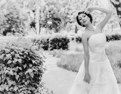 Beautiful bride with stylish make-up in white dress