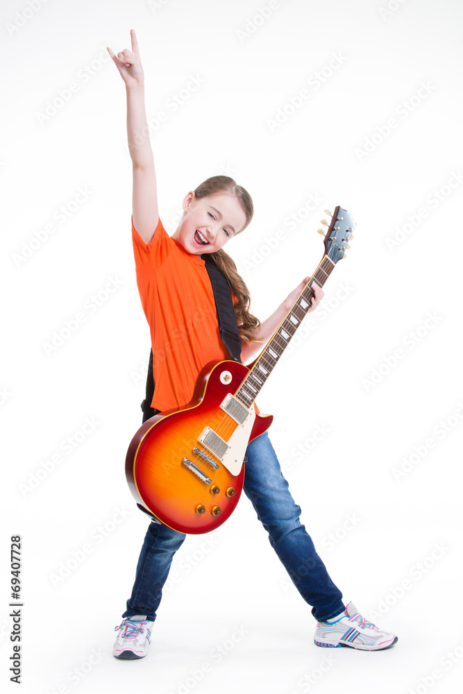 Cute girl plays on the electric guitar.