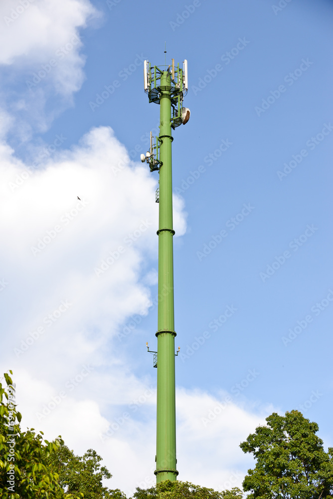 green communication towers in the park