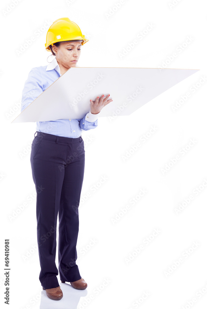 Female engineer analyzes a blueprints, isolated on white Female engineer analyzes a blueprints, isolated on white