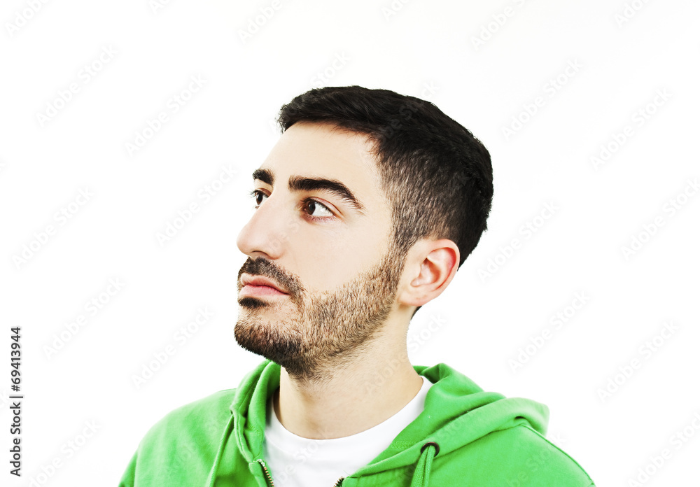 Fototapeta premium Young man looking up into the corner with lots of copy space