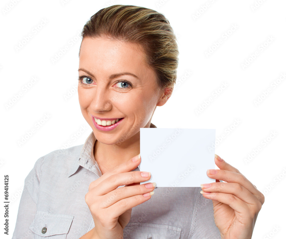 Attractive young woman showing empty blank paper card Attractive young woman showing empty blank paper card