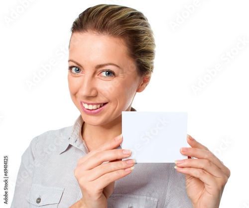 Attractive young woman showing empty blank paper card