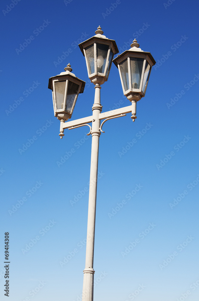 Lamp Post Street Road over blue sky Lamp Post Street Road over blue sky