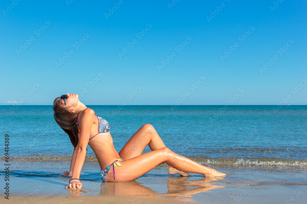 woman in bikini, outdoor on the beach woman in bikini, outdoor on the beach