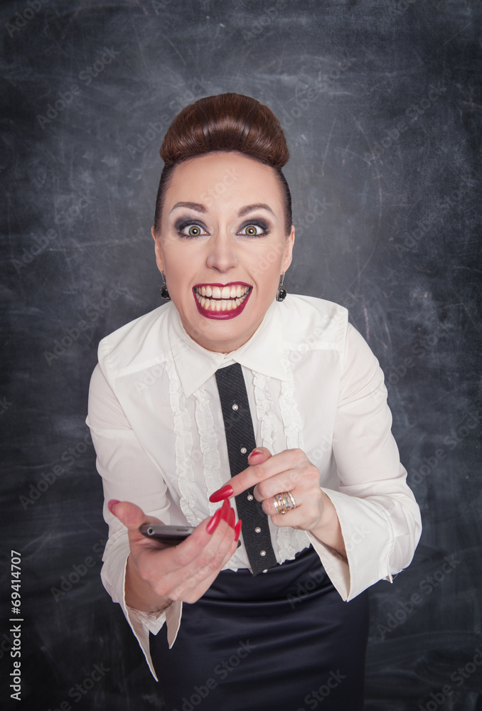 Fototapeta premium Angry business woman with mobile phone