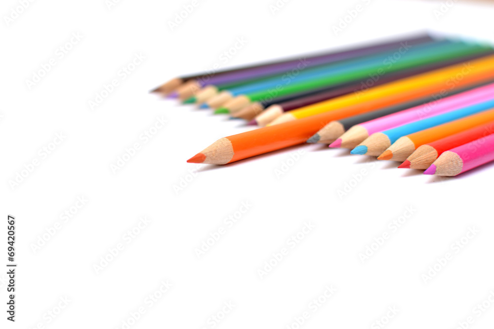 Colored pencils on white background