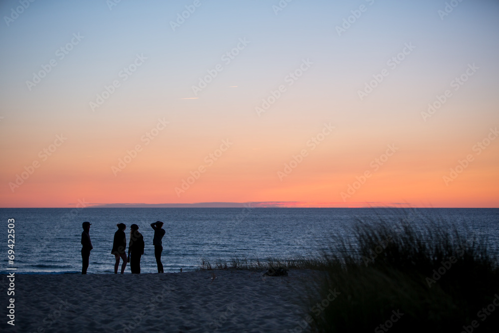 friends at beach in sunset