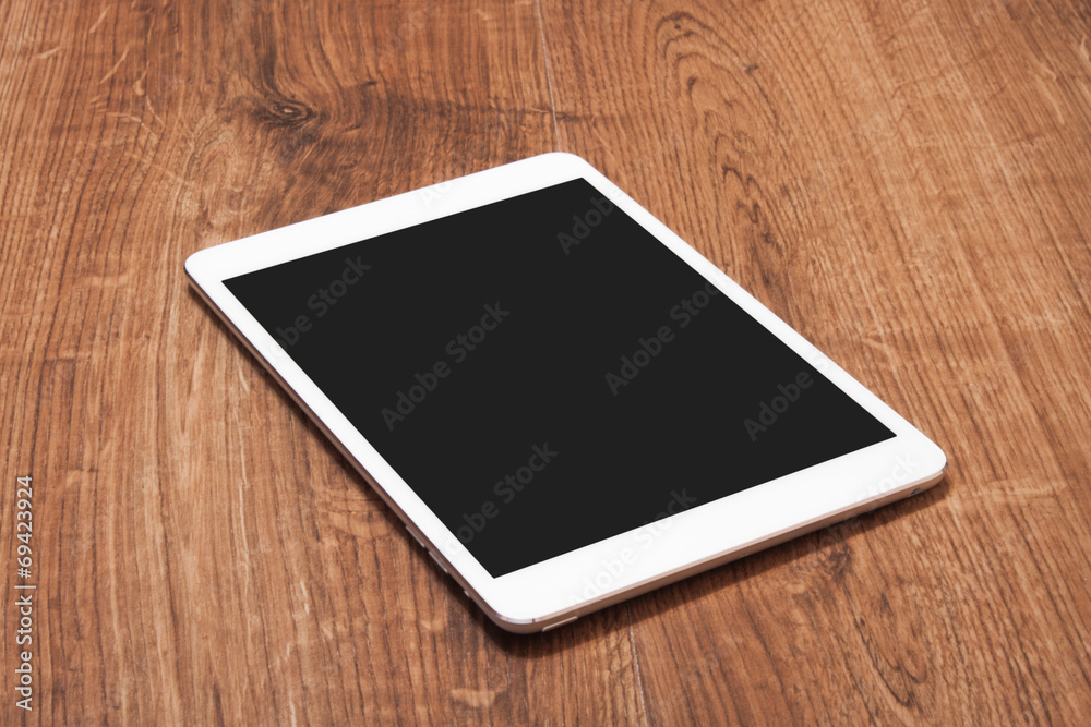digital tablet on wooden table digital tablet on wooden table