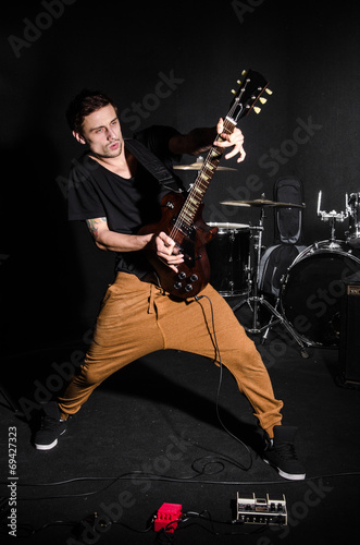 Man with guitar during concert