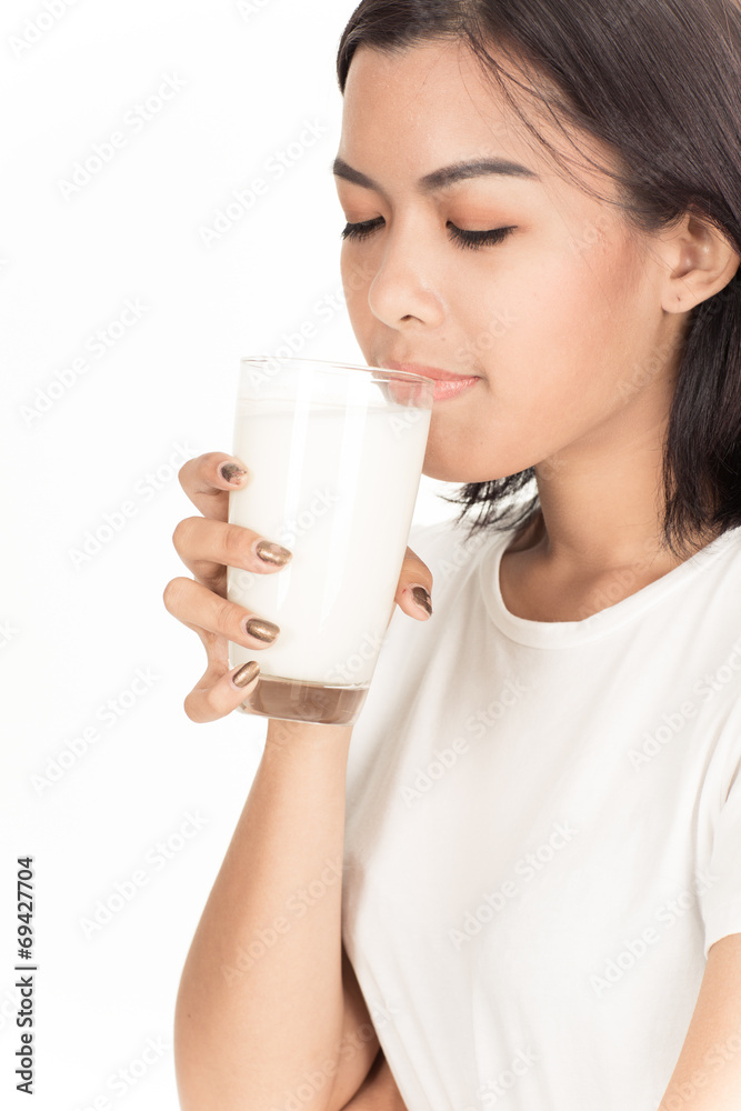 Laughing young woman with a glass of milk Laughing young woman with a glass of milk