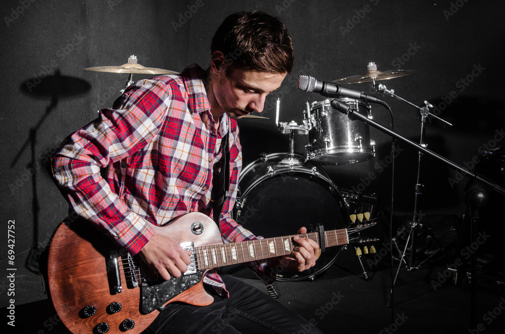 Fototapeta premium Man with guitar during concert