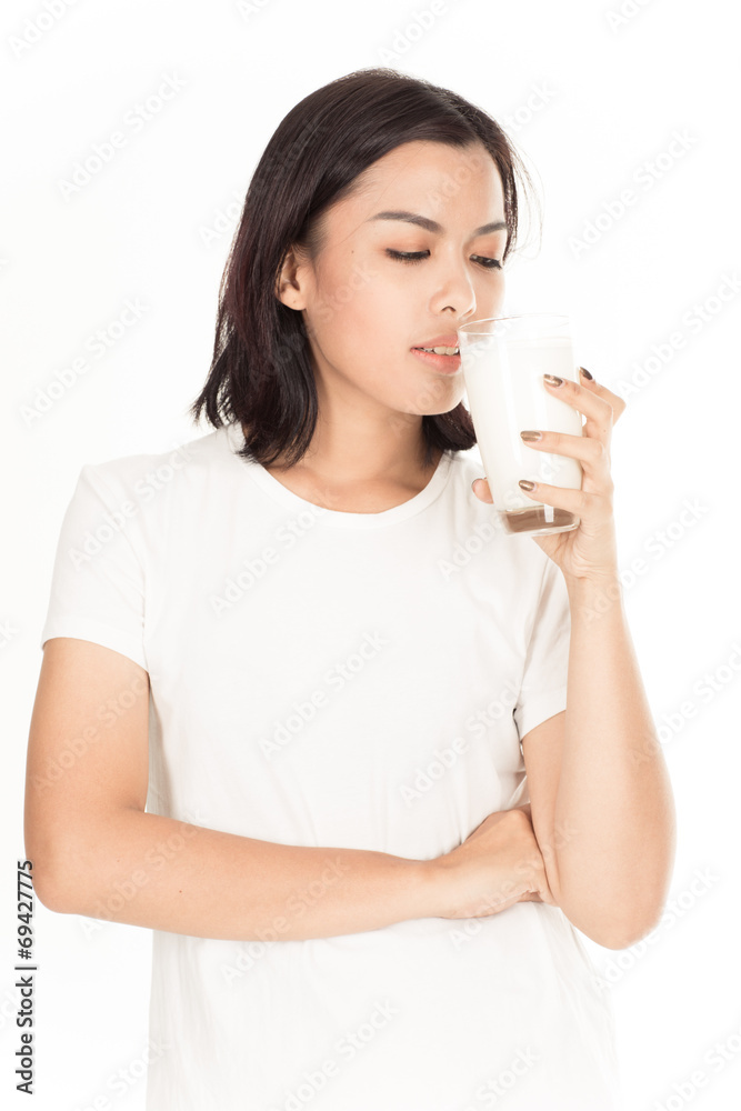 Laughing young woman with a glass of milk Laughing young woman with a glass of milk