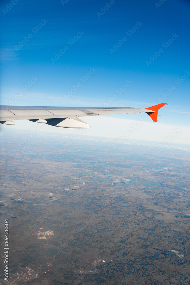 Airplane wing out of window Airplane wing out of window