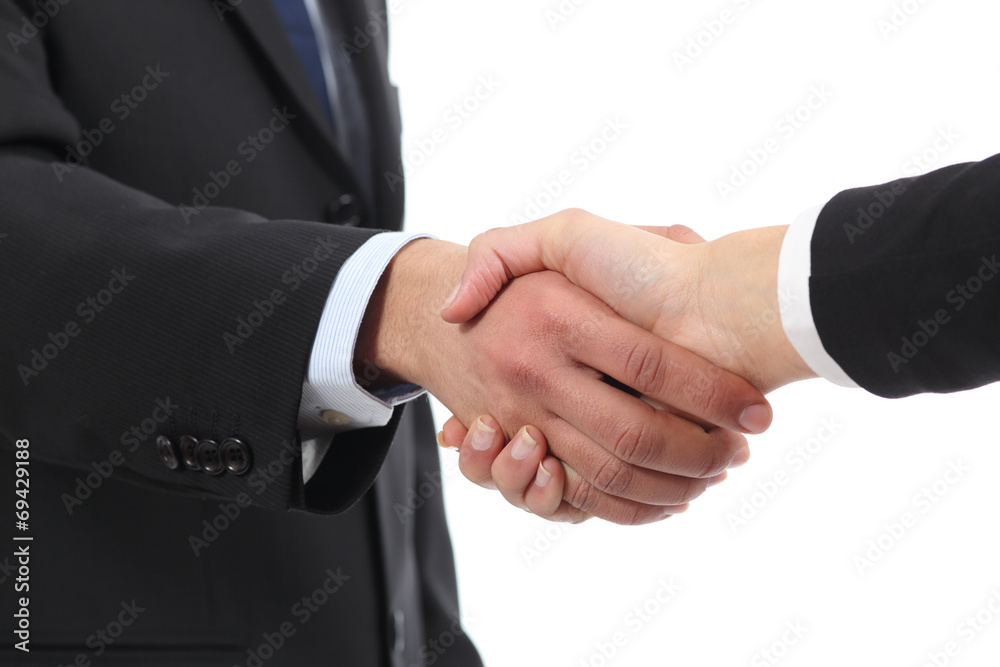 Closeup of a businessman and woman hands handshaking Closeup of a businessman and woman hands handshaking