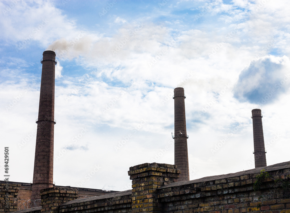 Three smoke stacks of the industrial plant