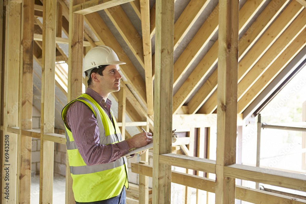 Building Inspector Looking At New Property Building Inspector Looking At New Property