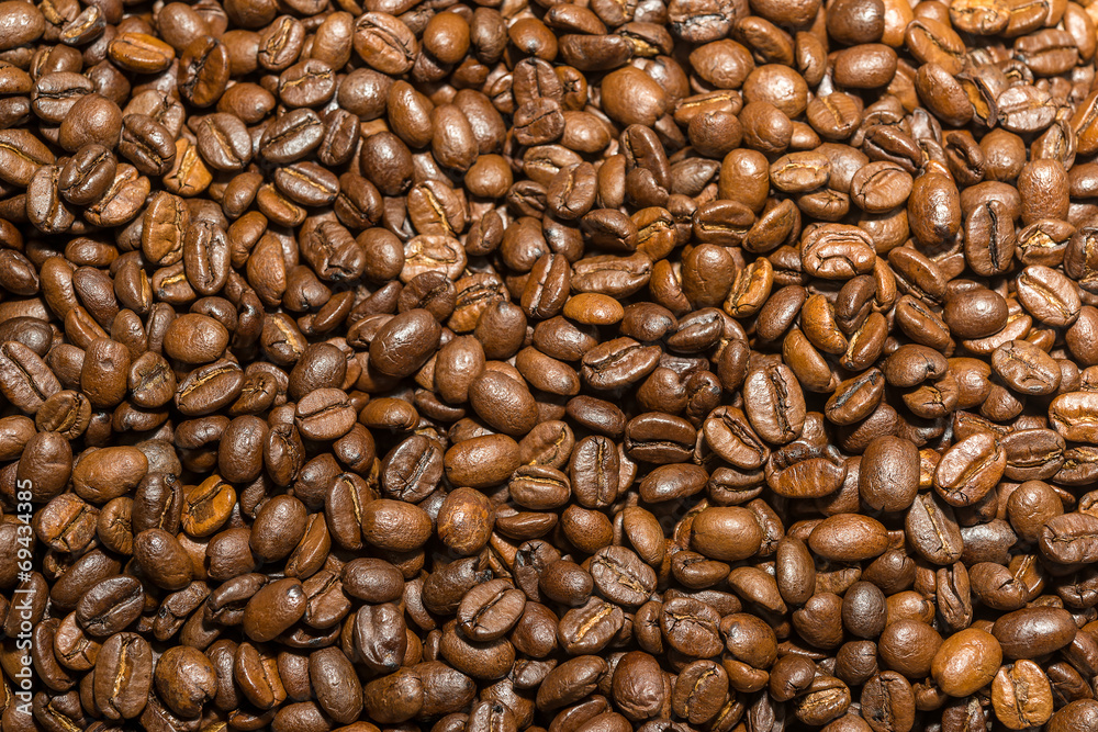 Naklejka premium roasted coffee beans background