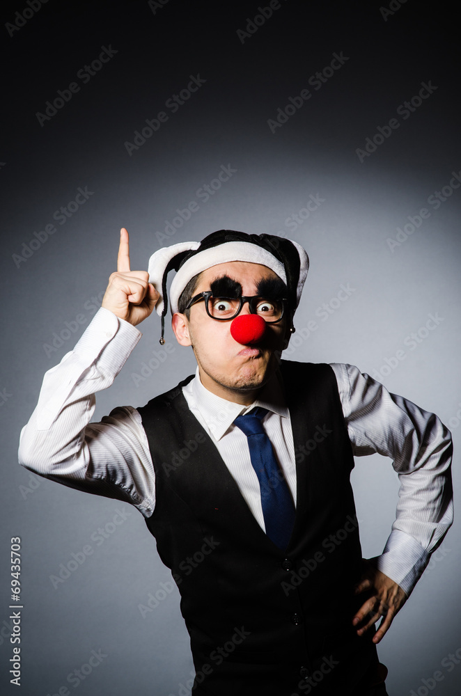 Fototapeta premium Clown businessman in funny concept