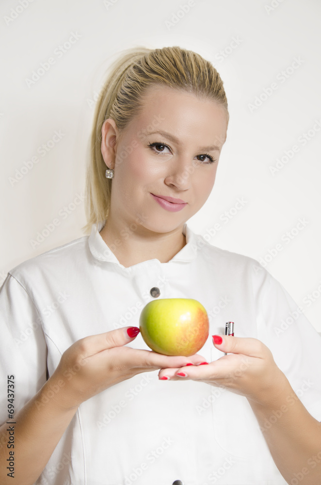 Doctor holding apple with both hands