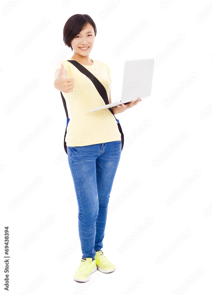 Smiling young woman holding a laptop and thumb up Smiling young woman holding a laptop and thumb up