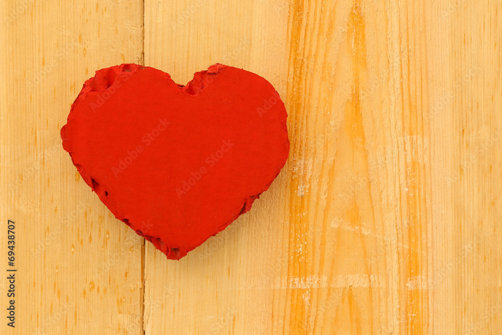 Love Valentines red cardboard heart on rough pine background