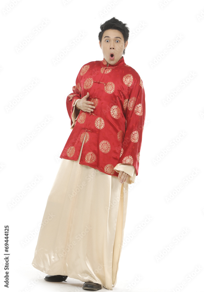 Oriental young man with tradition clothing posing Oriental young man with tradition clothing posing