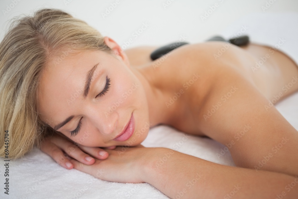 Beautiful blonde enjoying a hot stone massage Beautiful blonde enjoying a hot stone massage
