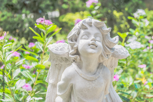 Fairy Statue in the garden with flower © coffmancmu