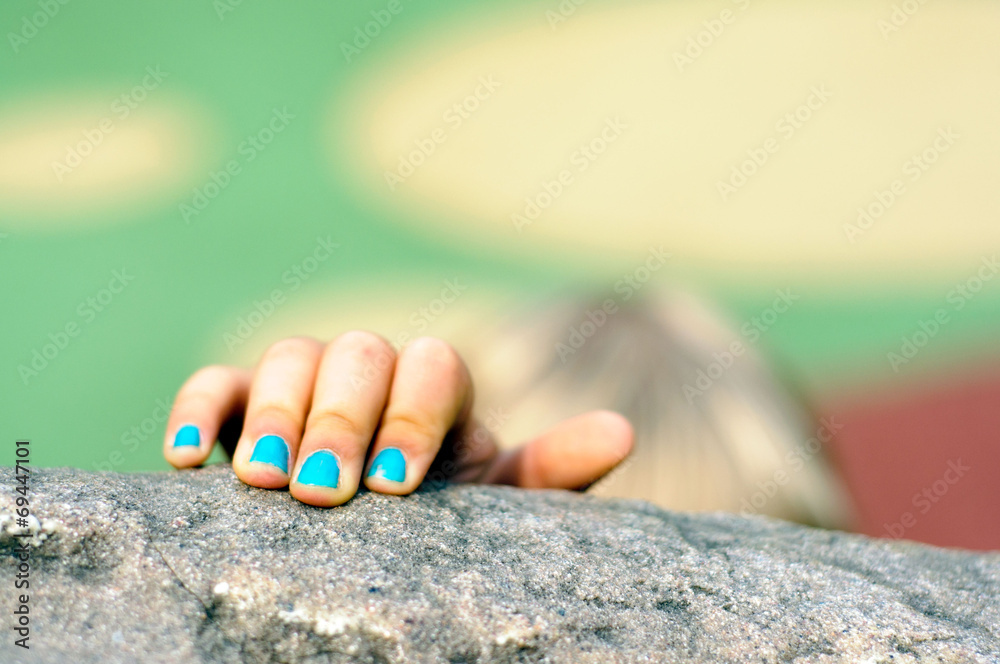 Naklejka premium Kid's hand in closeup