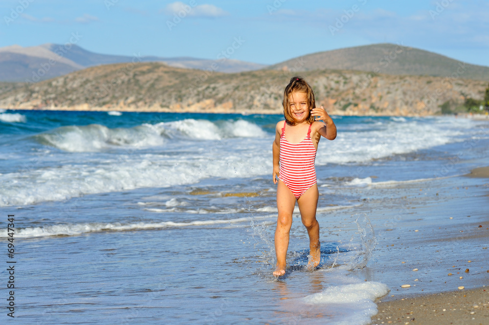 Toddler girl at beach