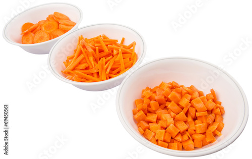 Different style of chopped carrots in white bowls 