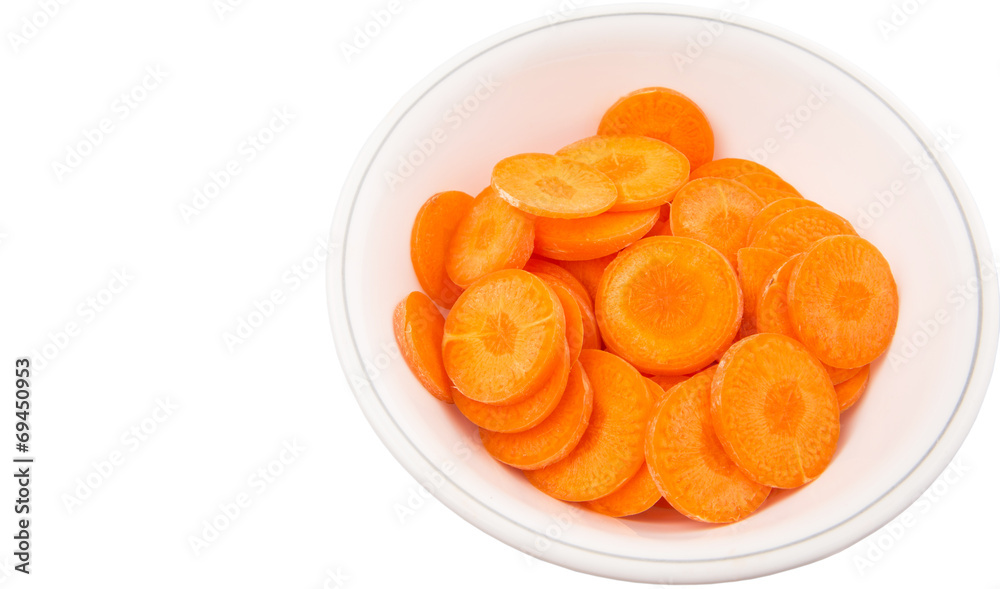 Chopped carrot in a bowl over white background Chopped carrot in a bowl over white background