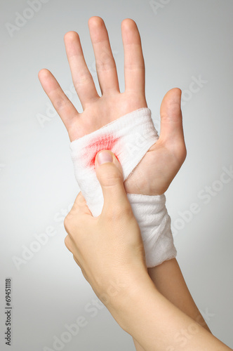 Injured hand with bloody bandage