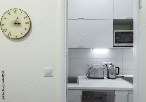 Small kitchenette studio and clock photo