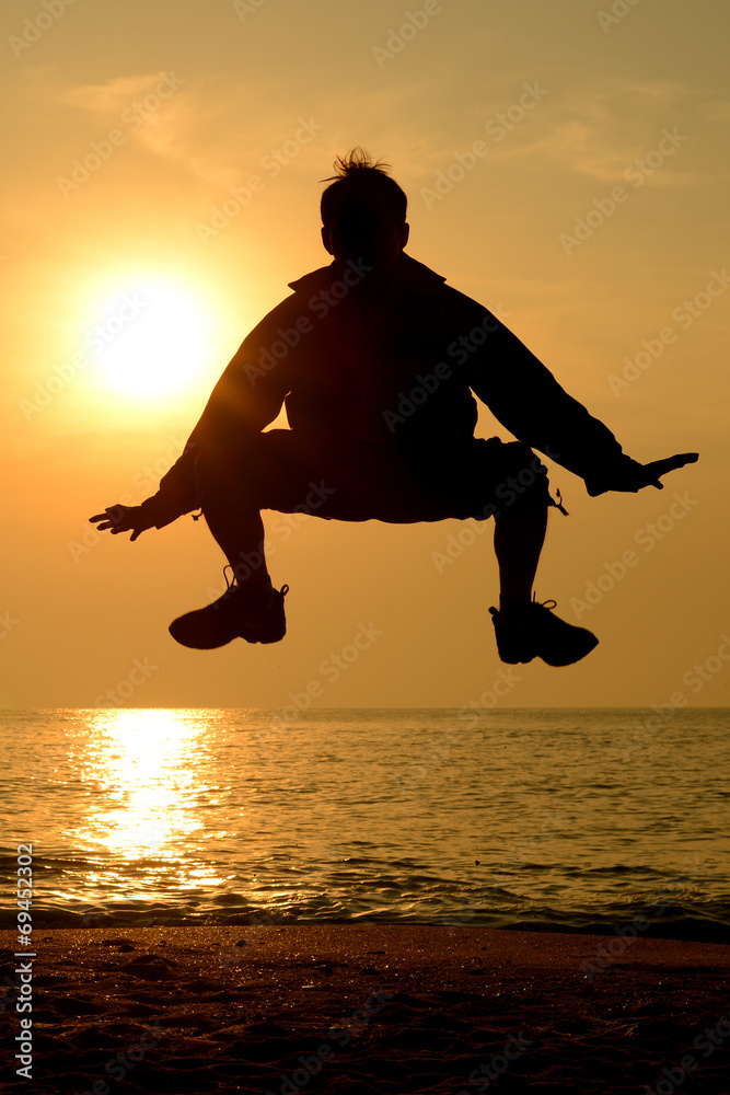 Obraz premium Silhouette happy person jumping Spider man action