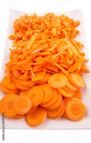 Different style of chopped carrots in a plate 