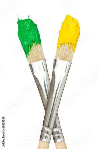 Paint brushes with yellow and green paints