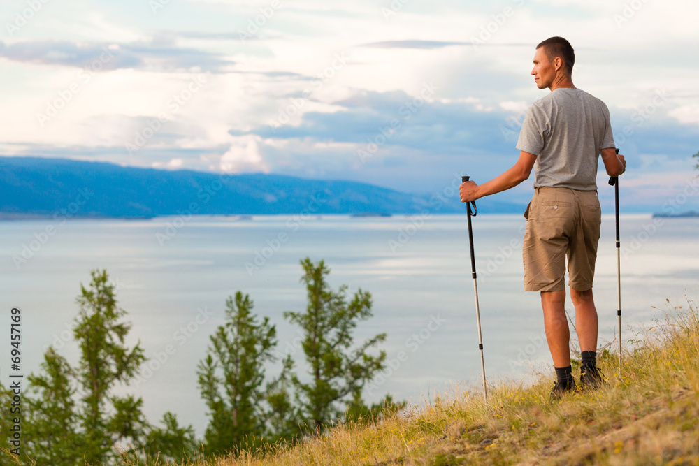 Hiker near the beautiful view of lake