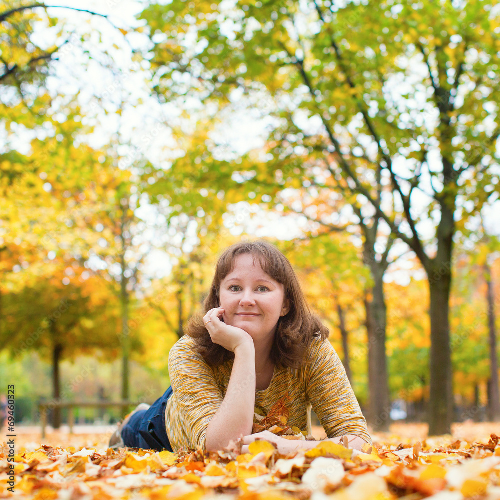 Girl enjoying bright fall day in park Girl enjoying bright fall day in park