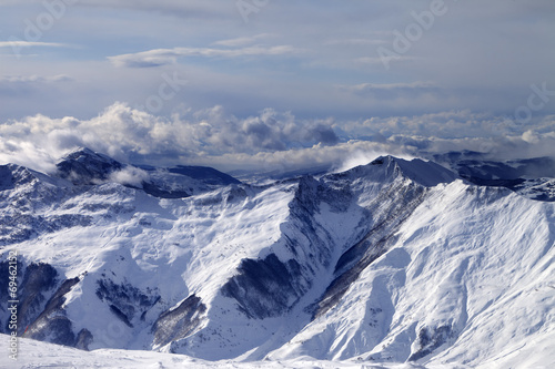 Winter mountains in clouds at windy day © BSANI