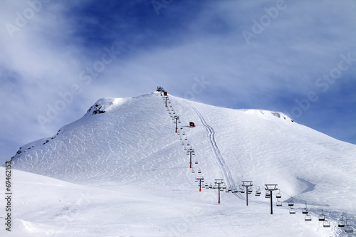 Ski slope and chair-lift at morning