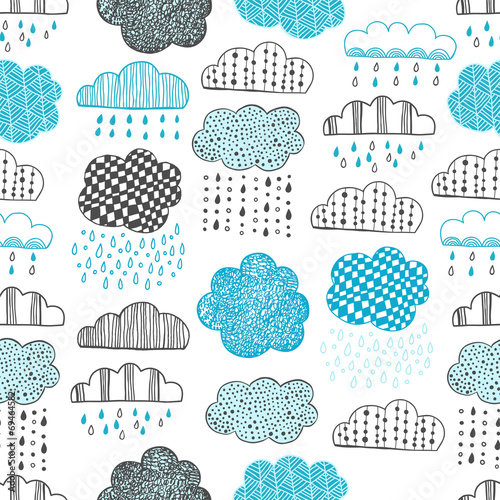 Seamless pattern of hand drawn doodle clouds