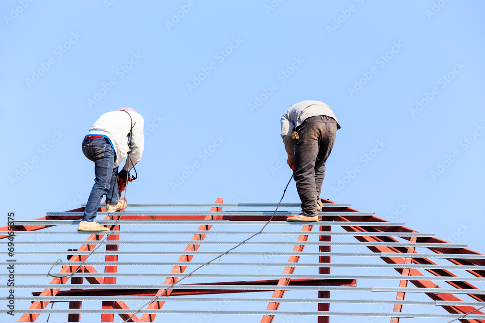 labor working in construction site for roof prepare