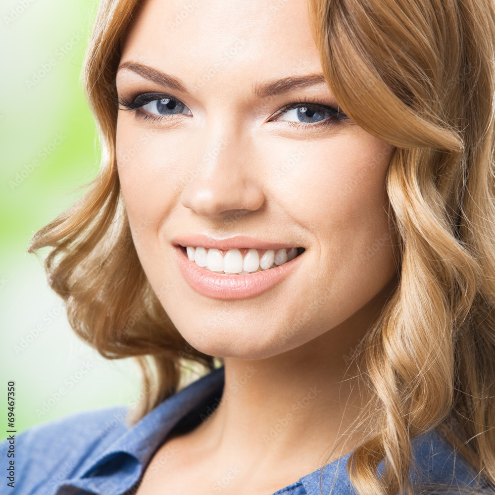 Happy smiling woman with long hair, outdoor Happy smiling woman with long hair, outdoor