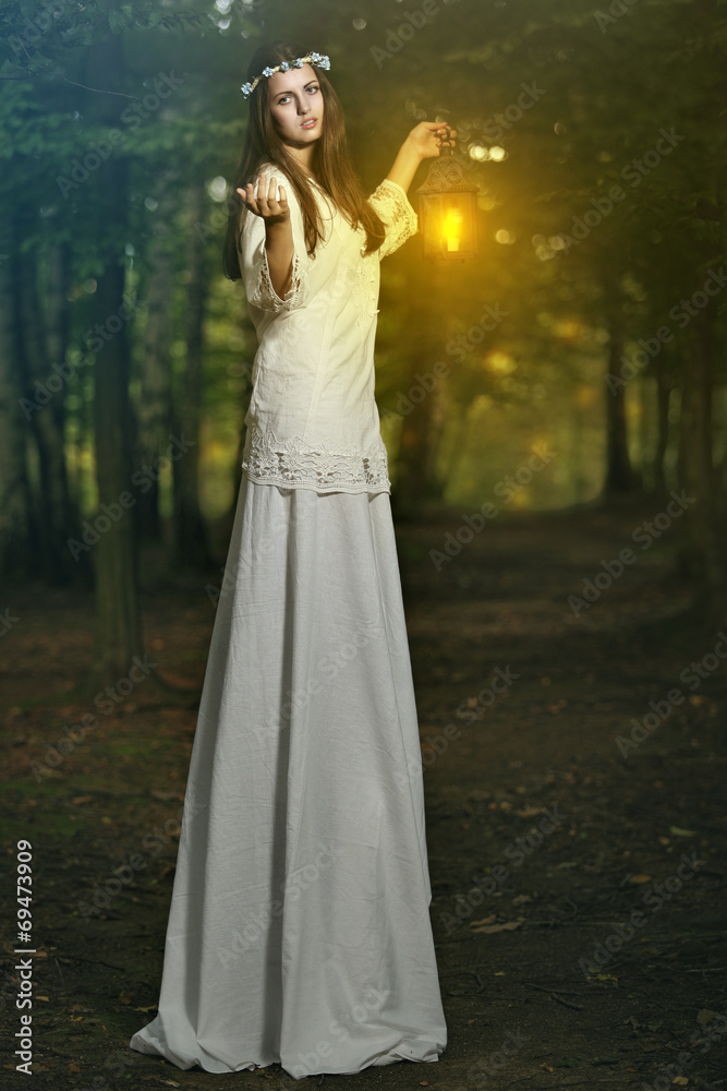 Fairy beautiful woman in magical forest