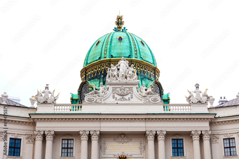 Hofburg palace cupola with decoratice sculptures on roof
