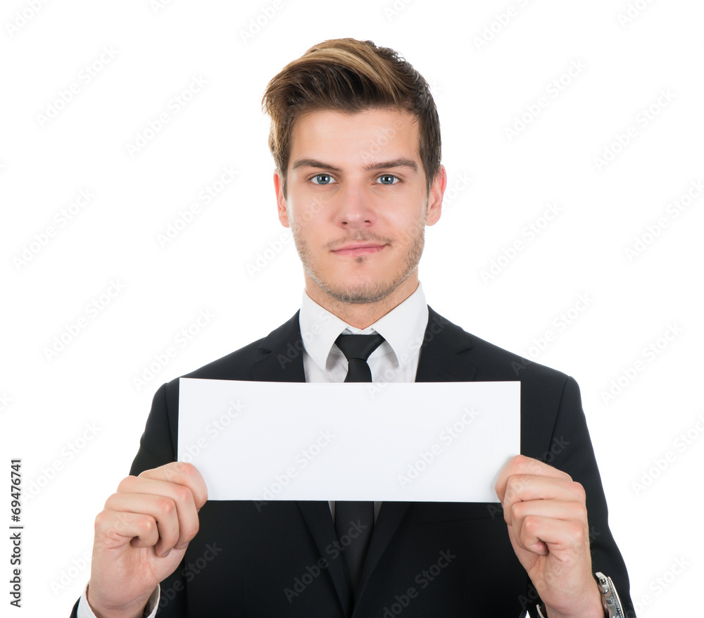 Portrait Of Confident Businessman Holding Blank Sign Portrait Of Confident Businessman Holding Blank Sign