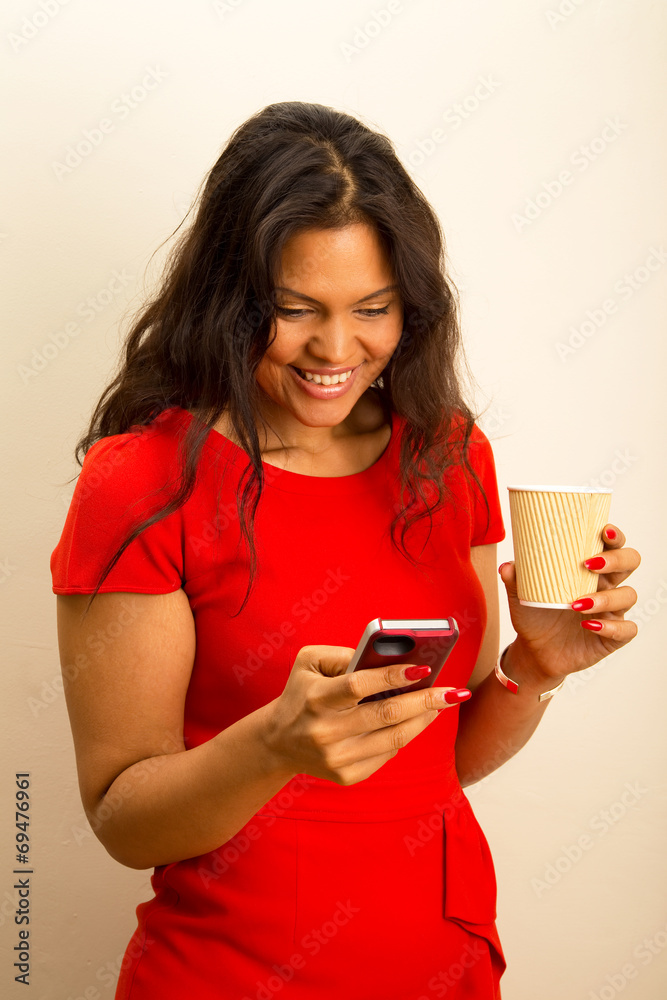 young woman sending text with coffee young woman sending text with coffee