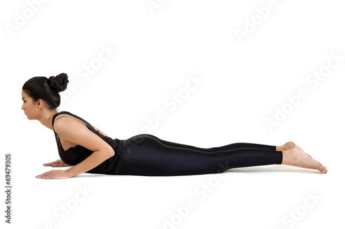 Pretty young woman training yoga